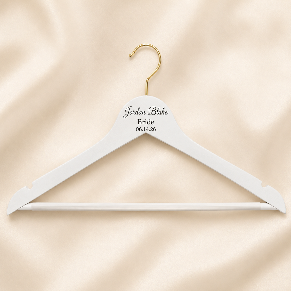 Personalized white wooden hanger engraved with a custom name and title